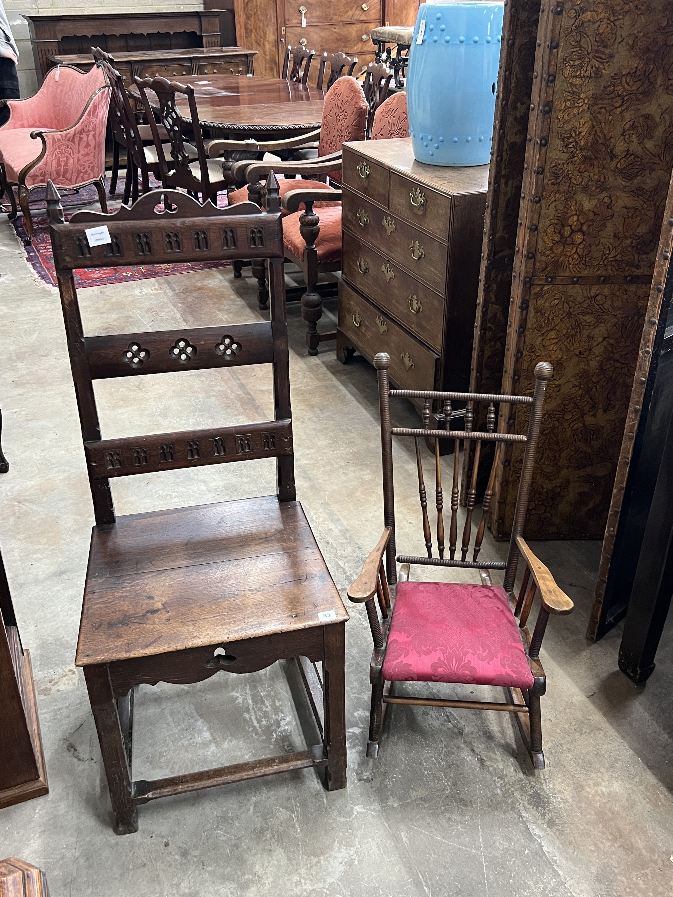 A Victorian carved oak high-back chair, width 49cm, height 118cm together with an early 20th century child's rocking chair